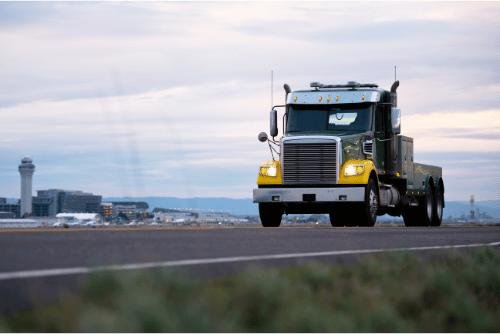 Transport truck moving cargo across cities